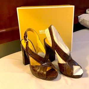 Original MICHAEL KORS shoe size 9.5, color brown. Brand new.